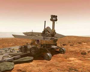The Mars Exploration Rover drives off from the landing craft. Image credit NASA/JPL. 