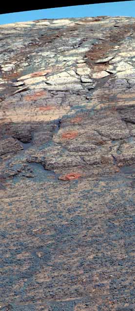 Layered rocks within Endurance crater with RAT holes, false color.  Image credit NASA/JPL.