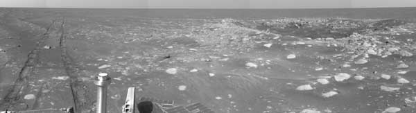 Opportunity, tracks in the sand plus a crater. Image credit NASA/JPL.
